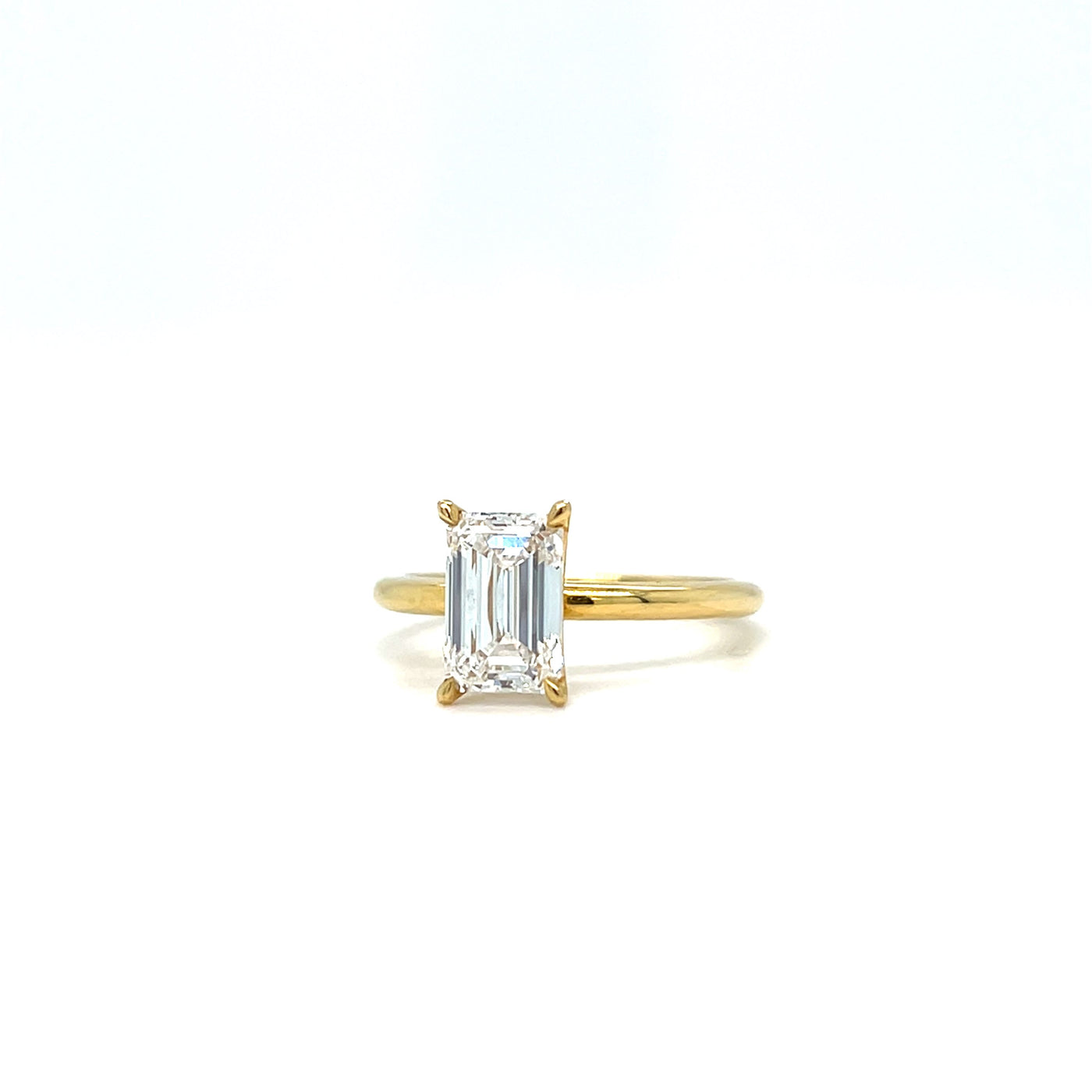 18CT yellow gold emerald cut diamond solitaire